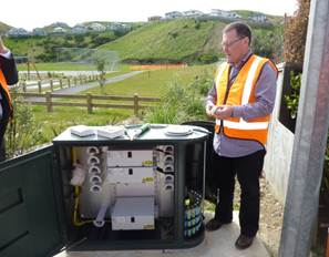 A Chorus representative showing the cabinet infrastructure supporting the copper and fibre networks